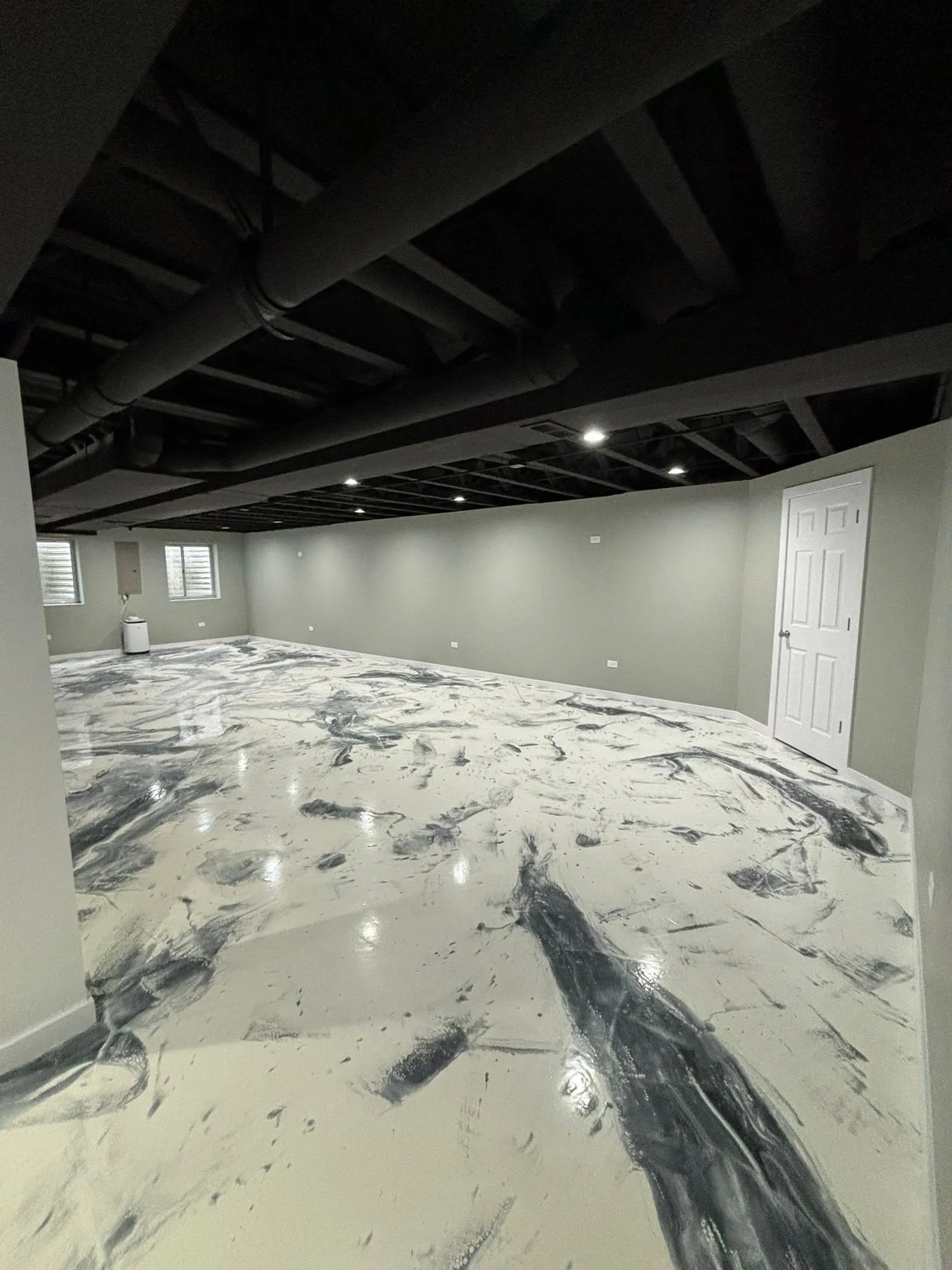 Finished basement with epoxy floor